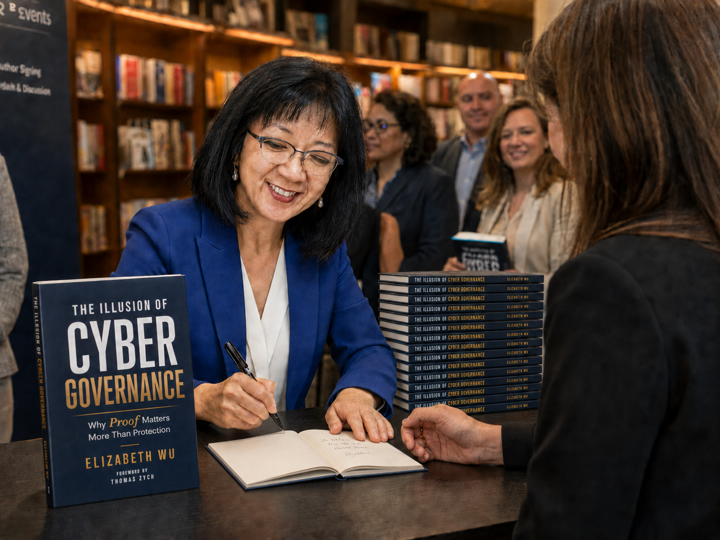 Elizabeth Wu signing The Illusion of Cyber Governance at an author event